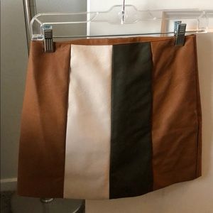 Vestique faux leather color block skit